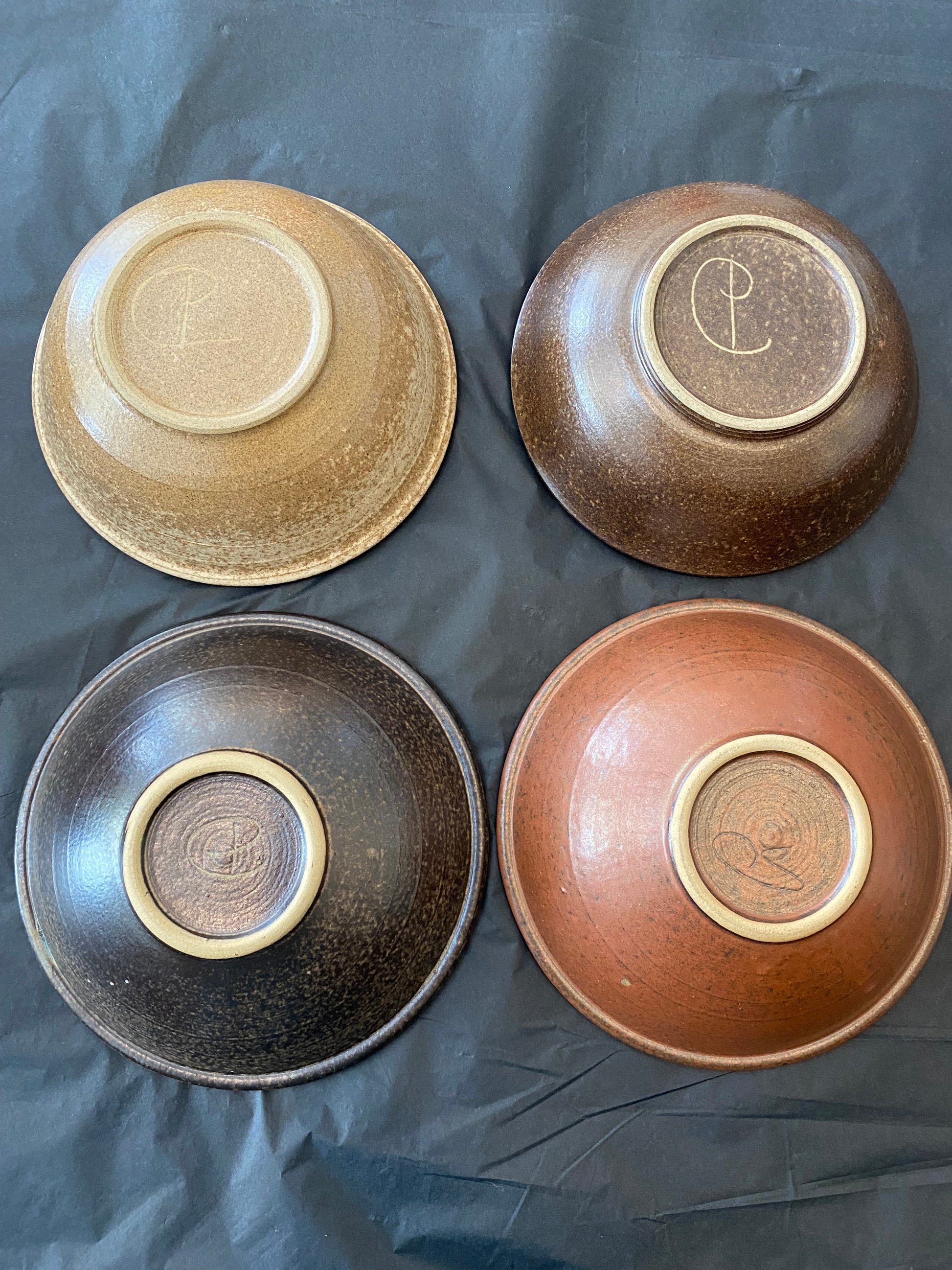 Shop this authentic 1970s set of 4 wheel-thrown stoneware bowls by Diana Worthy of Crich Pottery. Featuring a striking blue-green reactive glaze.