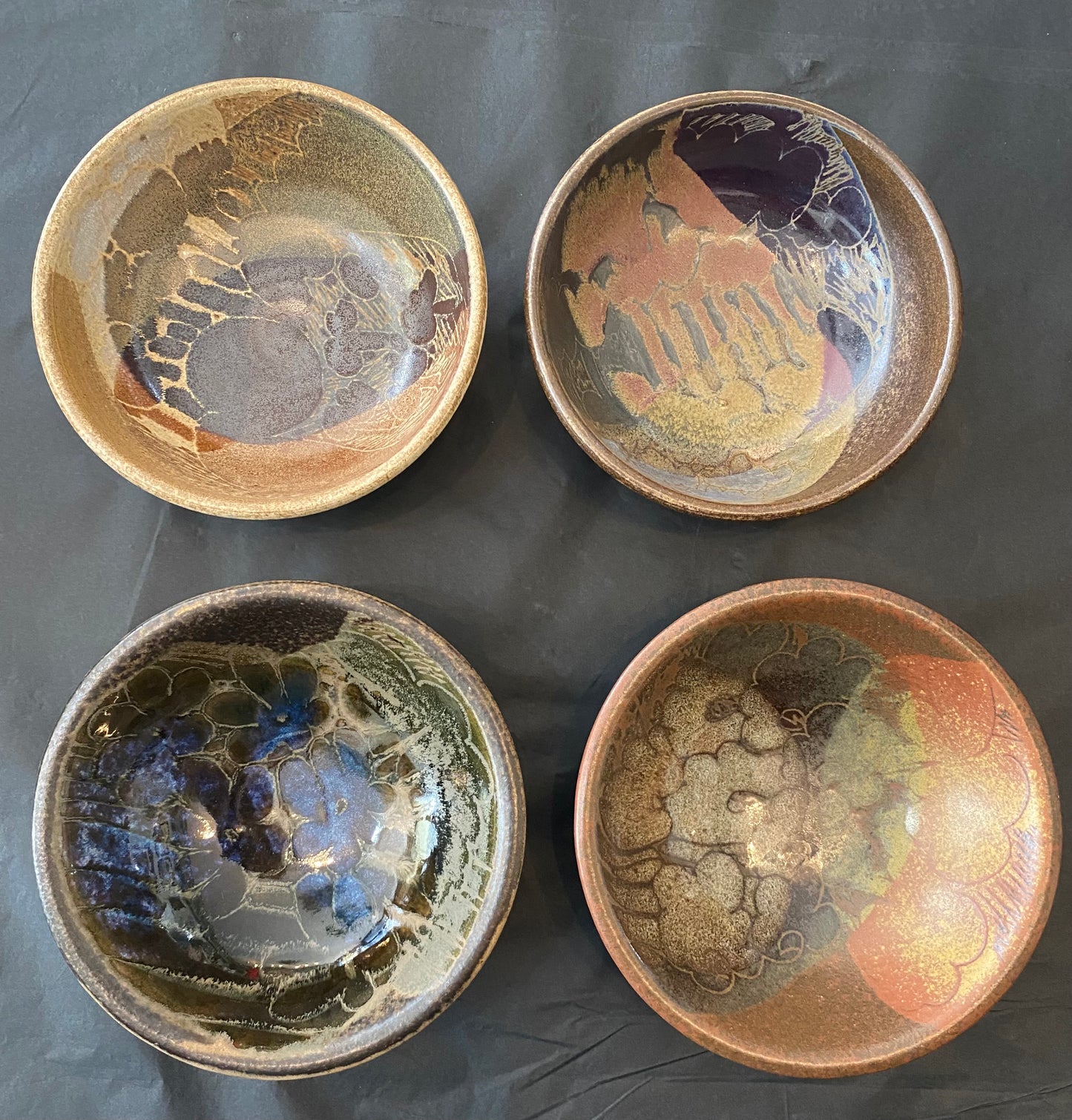 Shop this authentic 1970s set of 4 wheel-thrown stoneware bowls by Diana Worthy of Crich Pottery. Featuring a striking blue-green reactive glaze.