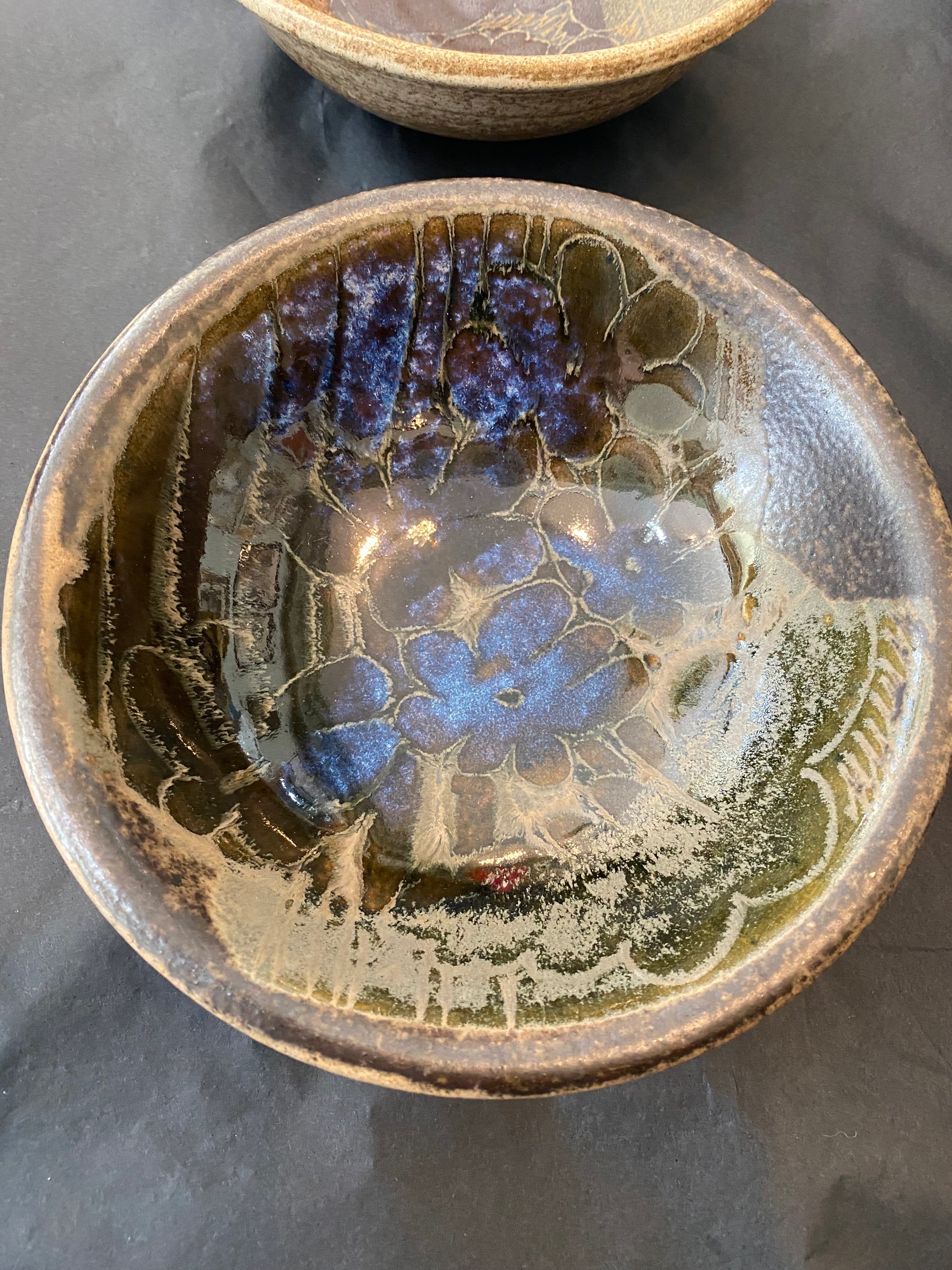 Shop this authentic 1970s set of 4 wheel-thrown stoneware bowls by Diana Worthy of Crich Pottery. Featuring a striking blue-green reactive glaze.